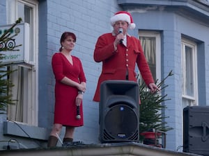 Robert Jones, senior joint master of the Radnor and West Herefordshire addresses the crowds watched by Burton Hotel owner Jana Hyde.