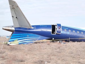 Rail of a blue plane crashed on the ground