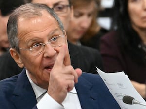 Sergey Lavrov gestures with his finger