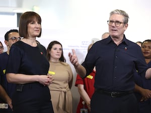 Prime Minister Sir Keir Starmer and Chancellor of the Exchequer Rachel Reeves speak to a group of people