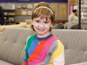 Fearne Stewart in a stripy jumper, smiling at the camera