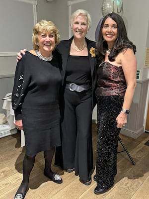 Mother and daughter members Ursla and Kandis pose with Tricia  Stewart (centre)