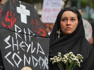 Ariana Campos takes part in a march marking the upcoming International Day for the Elimination of Violence Against Women, in Lima, Peru