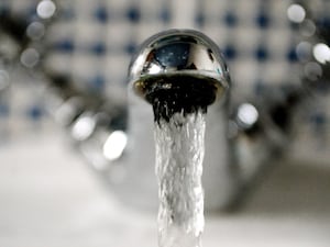 Water runs from a kitchen tap