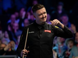 Kyren Wilson smiles in celebration