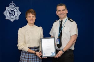 Mairi Kerin receiving the Chief Superintendent Commendation Award last month for her stepping in and chasing away a man threatening to take cash from a shop till in Hadley. Photo: West Mercia Police 