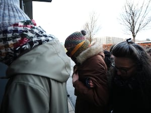 Dr Beth Upton (centre) arrives at an employment tribunal in Dundee