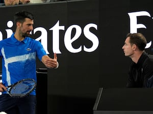 Andy Murray, right, and Novak Djokovic talk during a match