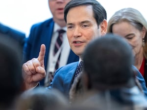 Marco Rubio pointing his finger as he speaks to people