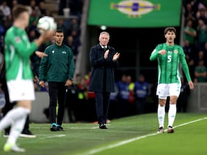 Northern Ireland manager Michael O'Neill claps on the touchline as his side prepares to take a throw-in