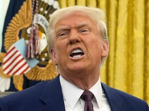 President Donald Trump speaks to reporters after signing an executive order in the Oval Office