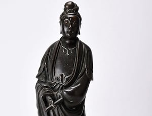 A Chinese silver-inlaid, bronze figure of Guanyin valued at up to £5,000.