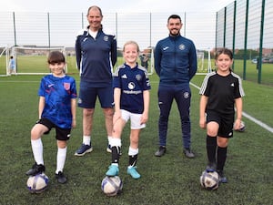 (From left): Coaches Steve Green and Lee Green with development players Isabelle Henderson, Molly Majski and Indie Davis.