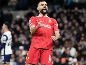 Liverpool’s Mohamed Salah celebrates scoring his side’s fourth goal against Tottenham