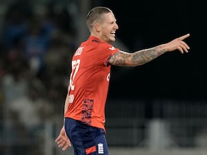 Brydon Carse celebrates a wicket