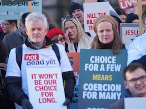 People take part in a demonstration at Old Palace Yard in Westminster, London, to oppose the Terminally Ill Adults (End of Life) Bill