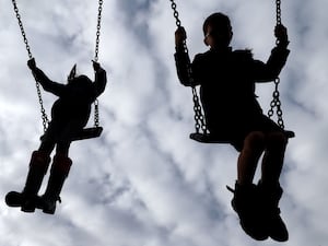 Children on swings in a playground