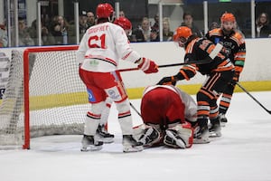 Telford Tigers' Scott McKenzie tries to force the puck past the Swindon Wildcats netminder (Picture: Lauren Rankin)