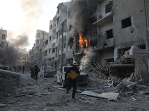 A building on fire in Idlib city