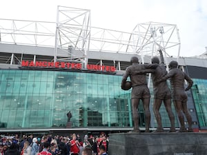 A general view of the United Trinity statue outside Old Trafford