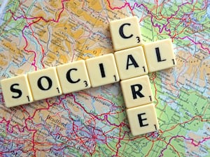 Social Care spelled out in Scrabble letters on a map of England