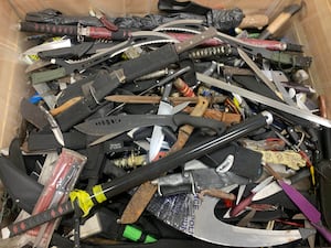 A bin of seized knives. A new AI tool from the University of Surrey has been unveiled which could help police forces more quickly identify and trace knives.