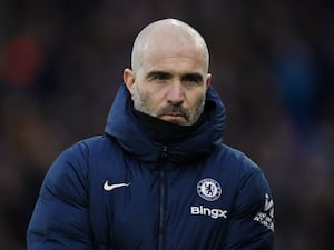 Enzo Maresca, wearing a coat and snood, on the touchline