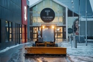 Workers out clearing routes at Telford Town Centre. Picture: Jamie Ricketts