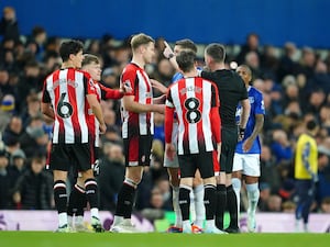 Brentford protest the sending off of Christian Norgaard