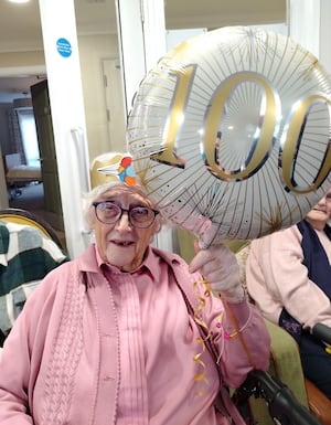 100 years young - Iris with her birthday balloons