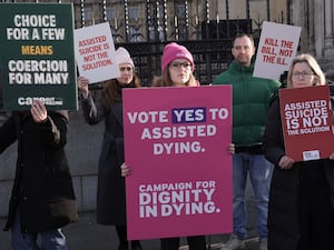 Pro and anti-assisted dying campaigners outside Parliament