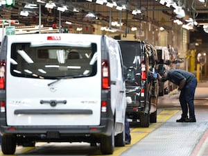 Workers on the Vauxhall plant production line