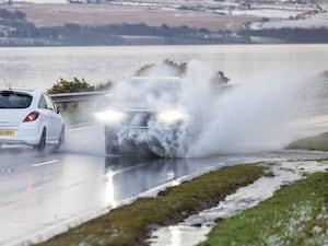 Cars driving through surface water