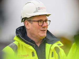 Prime Minister Sir Keir Starmer wearing a hard hat and a high-vis jacket