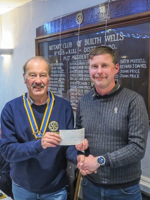 Left to right Builth Wells Rotary President, Robert Evans, presents Parkrun organiser, Lee Jarvis with a cheque.