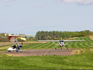 A microlight and a small plane at Fife Airport