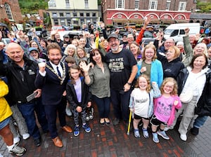 Chris and Marianne Fisher surrounded by supporters in Ironbridge. 