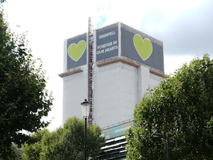 Grenfell Tower covered in tarpaulins