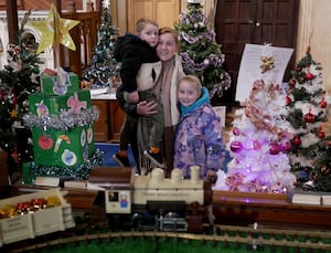 Tyger Dawson, four, mum Annabell Simpson and Skylar Dawson enjoyed looking around the Christmas Tree Festival at Holy Trinity Church in Llandrindod Wells. Image: Andy Compton