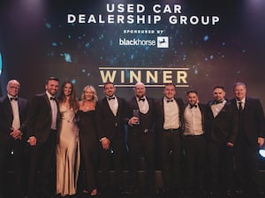 The triumphant Greenhous team on stage at the Used Car Awards, flanked by compere and host Mike Brewer, right, and Tim Smith, Head of Black Horse Distribution. Black Horse is the headline sponsor of the awards.