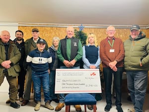 From left, Keith Williams, Craig Price, Thomas Owen, Walter Rogers, Mary Owen, Ralph Owen, Amy Owen, Wales Air Ambulance representative Andrew Catling and James Owen.