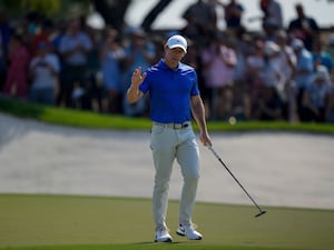 Rory McIlroy acknowledges the crowd at Jumeirah Golf Estates