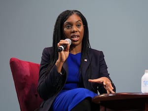 Conservative party leader Kemi Badenoch speaking into a microphone