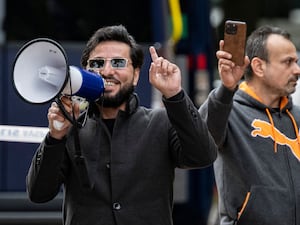 Salwan Momika using a megaphone at a protest