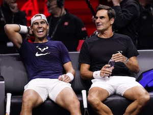 Roger Federer, right, shares a joke with Rafael Nadal