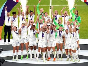 England’s Leah Williamson and Millie Bright lift the Euro 2022 trophy