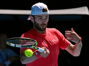 Jacob Fearnley plays a forehand