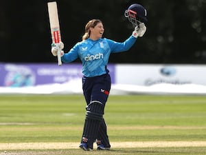 England’s Tammy Beaumont celebrates reaching 150 runs against Ireland in September