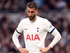 Rodrigo Bentancur pictured with his hands on his hips playing for Tottenham