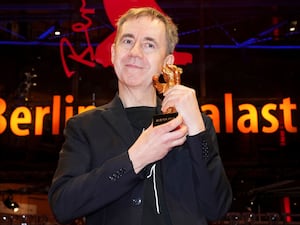 Dag Johan Haugerud, winner of the Golden Bear for best film, poses for photographers